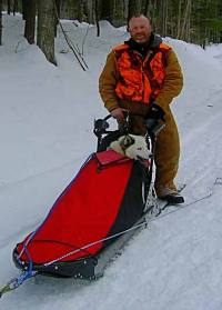 Beth hitches a ride in the sledbag