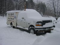 Our dog truck covered in fresh snow