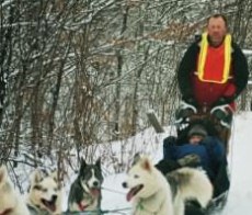 Trey and Harry at wheel, my wife tucked in the sledbag.